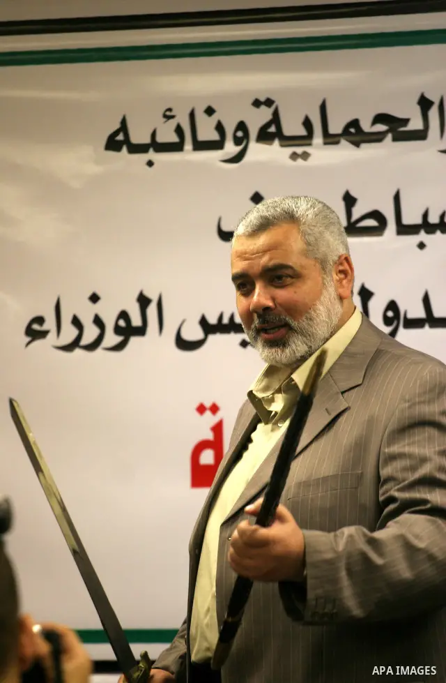 Senior Hamas leader Ismail Haniyeh attends the graduation of new Hamas security group at the former headquarters of palestinian president Mahmoud Abbas, in Gaza City. Haniyeh sought on Thursday to calm tensions with neig...