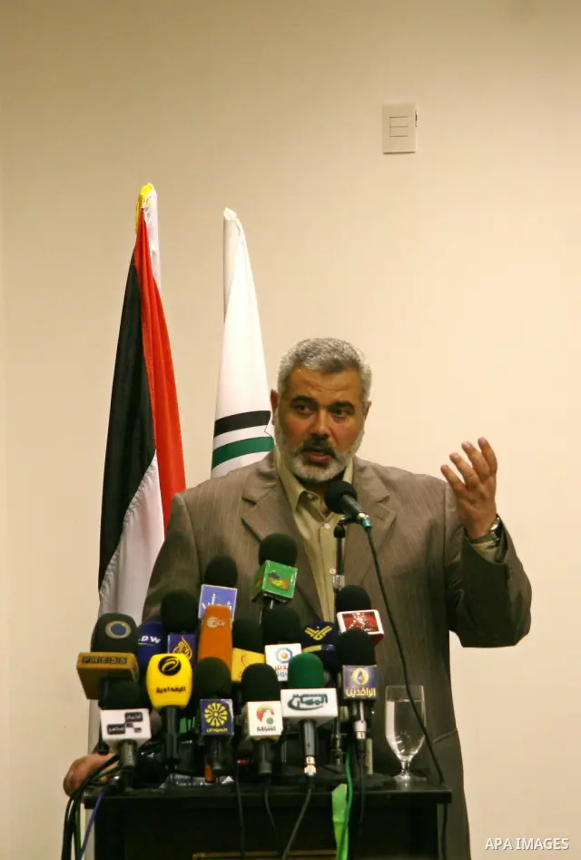 Senior Hamas leader Ismail Haniyeh attends the graduation of new Hamas security group at the former headquarters of palestinian president Mahmoud Abbas, in Gaza City. Haniyeh sought on Thursday to calm tensions with neig...