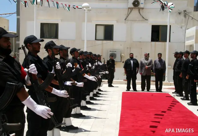 Senior Hamas leader Ismail Haniyeh attends the graduation of new Hamas security group at the former headquarters of palestinian president Mahmoud Abbas, in Gaza City. Haniyeh sought on Thursday to calm tensions with neig...