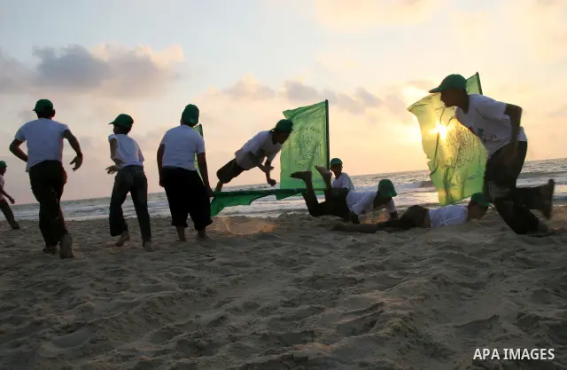 Palestinian teenagers training as they attend a summer camp organized by Hamas in Gaza City. Thousands of Palestinian teenagers are taking part in summer camps organized by the Islamist movement.