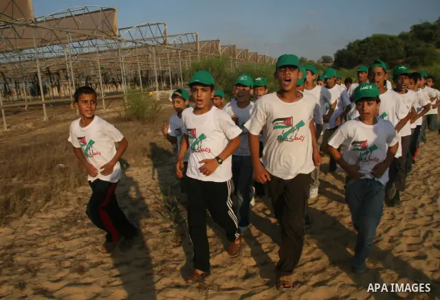 Palestinian teenagers training as they attend a summer camp organized by Hamas in Gaza City. Thousands of Palestinian teenagers are taking part in summer camps organized by the Islamist movement.