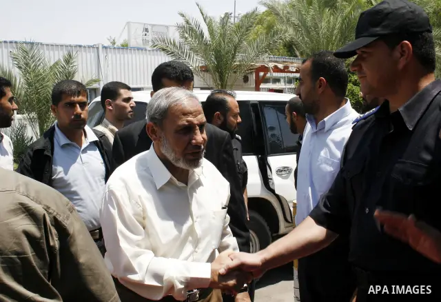 Palestinian senior Hamas official Mahmud Zahar walks through the Rafah border terminal crossing between the southern Gaza Strip and Egypt. A Hamas delegation is due in Cairo for talks on a fragile three-week-old Gaza tru...