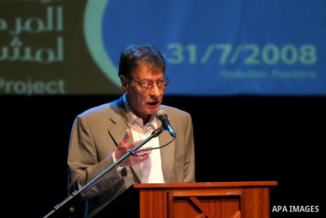 Palestinian poet Mahmoud Darwish presents a poetry soiree, in the West Bank city of Ramallah.