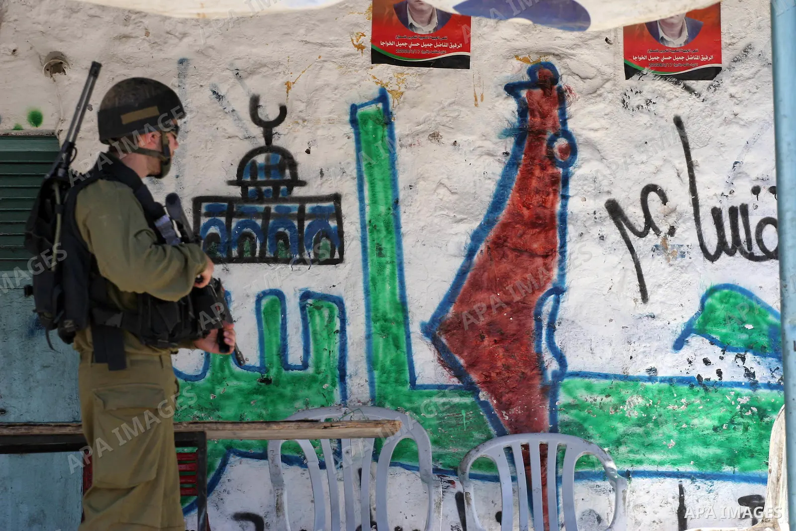 Israeli soldiers are seen during clashes with Palestinian youths near the construction site of Israel's controversial separation barrier in the West Bank village of Nilin, west of Ramallah. Israel says the barrier, which...