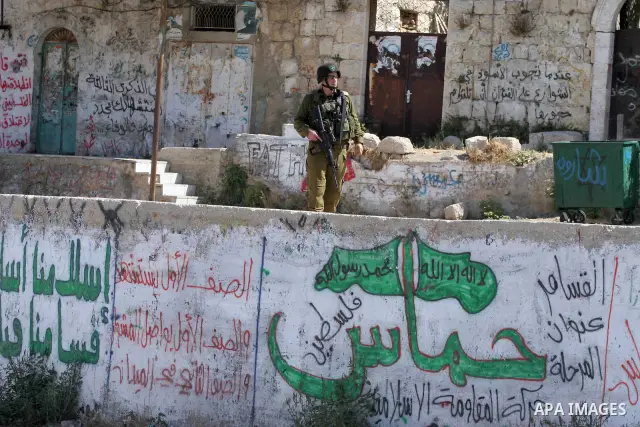 Israeli soldiers are seen during clashes with Palestinian youths near the construction site of Israel's controversial separation barrier in the West Bank village of Nilin, west of Ramallah. Israel says the barrier, which...