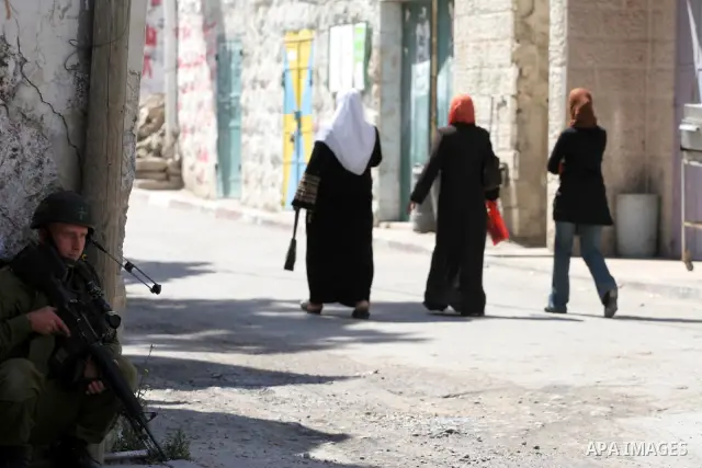 Israeli soldiers are seen during clashes with Palestinian youths near the construction site of Israel's controversial separation barrier in the West Bank village of Nilin, west of Ramallah. Israel says the barrier, which...