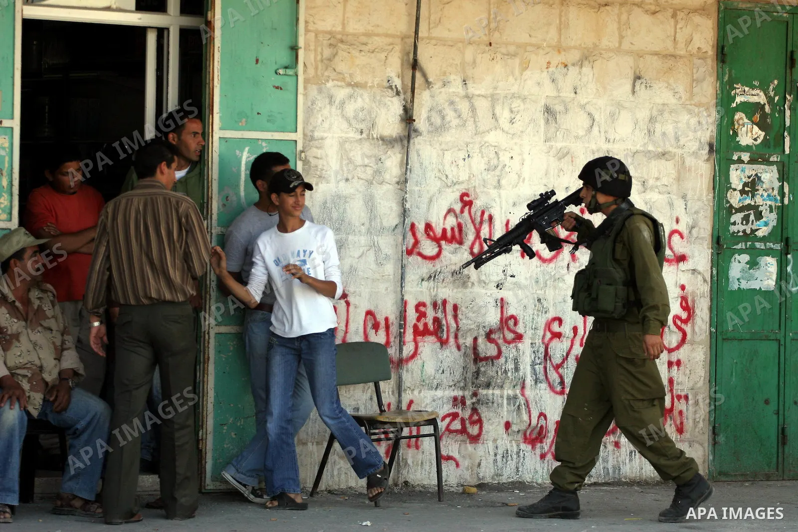 Israeli soldiers are seen during clashes with Palestinian youths near the construction site of Israel's controversial separation barrier in the West Bank village of Nilin, west of Ramallah. Israel says the barrier, which...