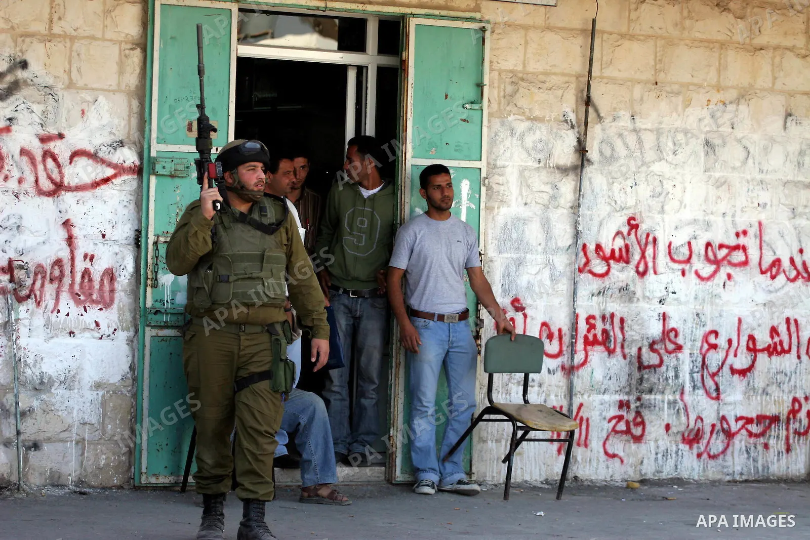 Israeli soldiers are seen during clashes with Palestinian youths near the construction site of Israel's controversial separation barrier in the West Bank village of Nilin, west of Ramallah. Israel says the barrier, which...