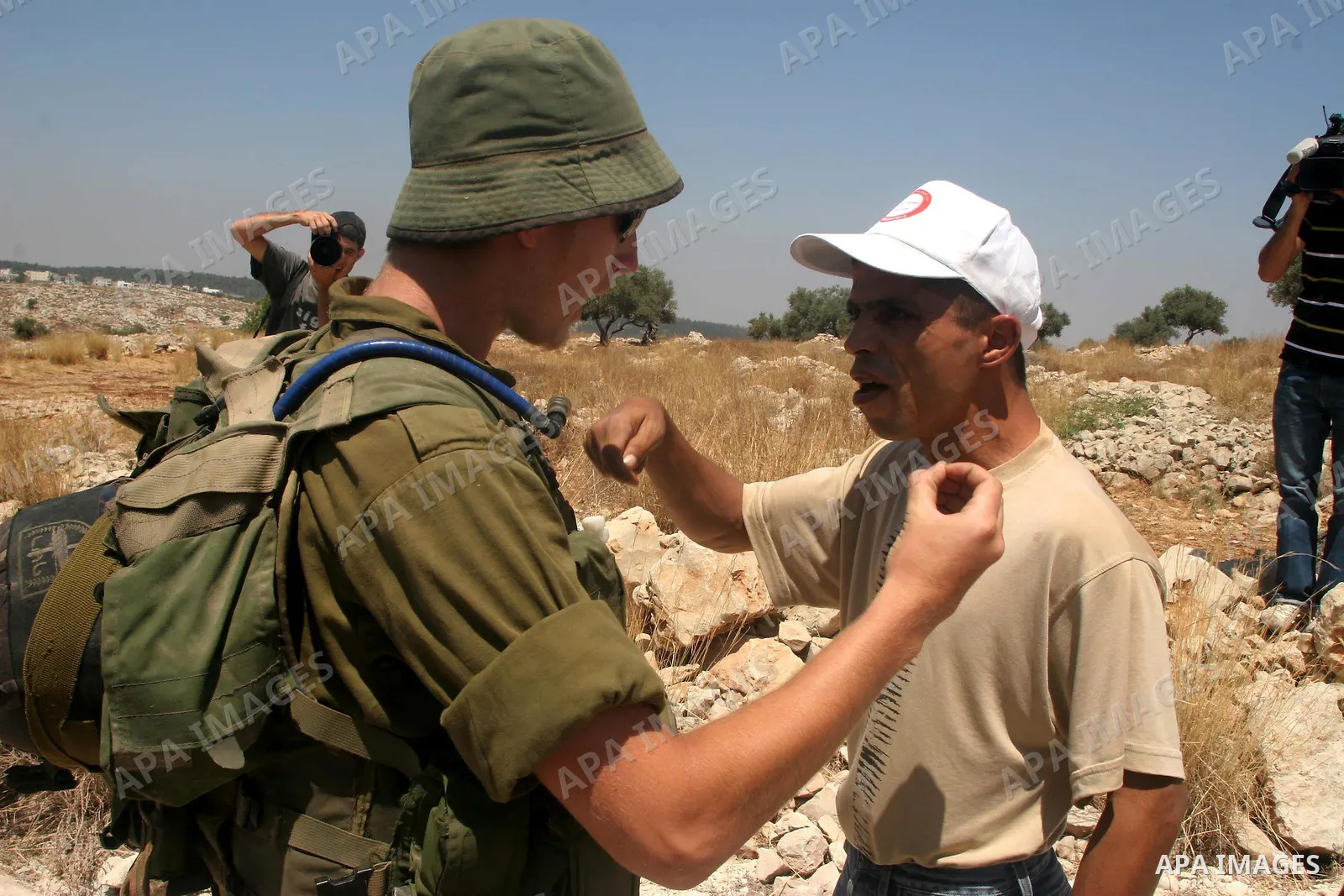 Israeli border policemen scuffle with Palestinians and international peace protesters during a demonstration against the construction of the controversial Israeli barrier in the West Bank village of Nilleen near Ramallah...