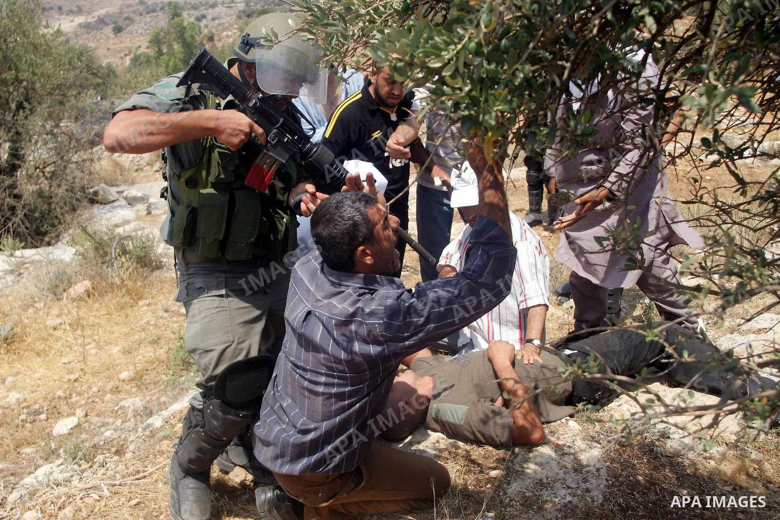 Israeli soldiers scuffle with Palestinian and international protestors during a demonstration against the construction of the controversial Israeli cement barrier in the West Bank village of Nilin near Ramallah. Sixteen...