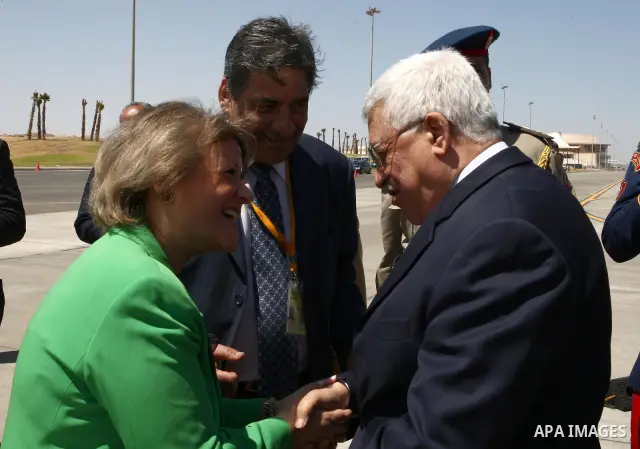 Palestinian President Mahmoud Abbas is received by Egyptian Minister of Development and International Relations, Fayza Abul Naga during his arrival in Sharm el-Sheikh City, in Egypt.