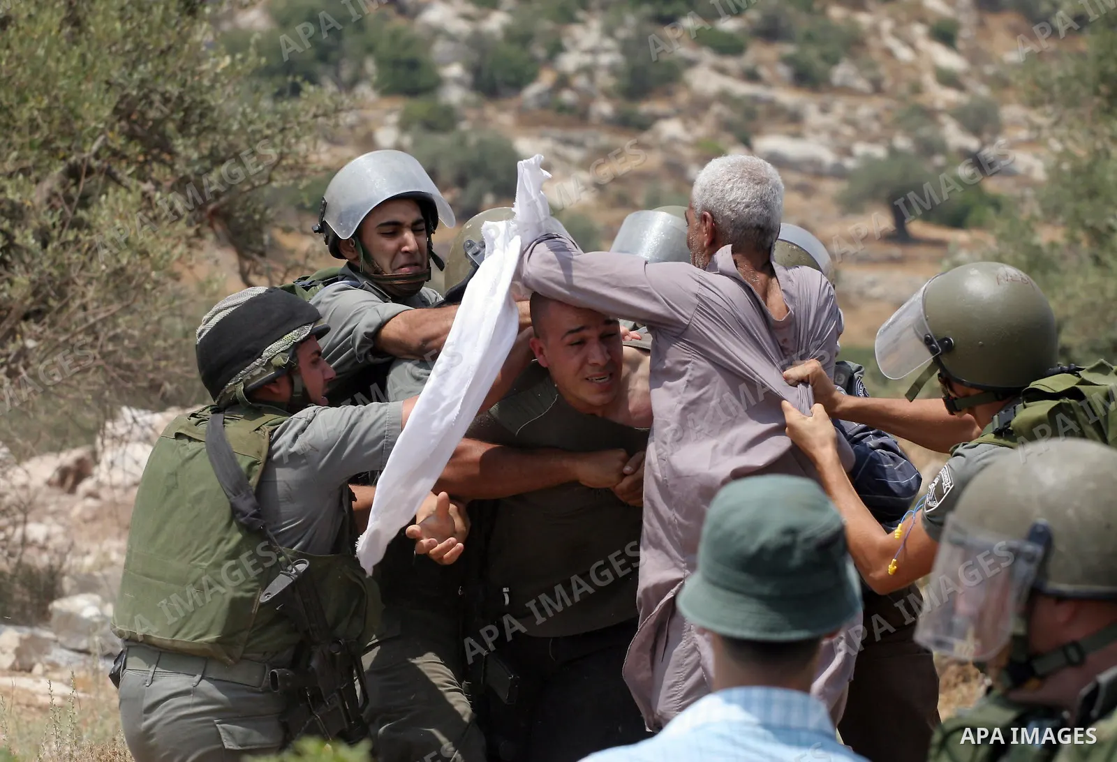 Israeli soldiers scuffle with Palestinian and international protestors during a demonstration against the construction of the controversial Israeli cement barrier in the West Bank village of Nilin near Ramallah. Sixteen...