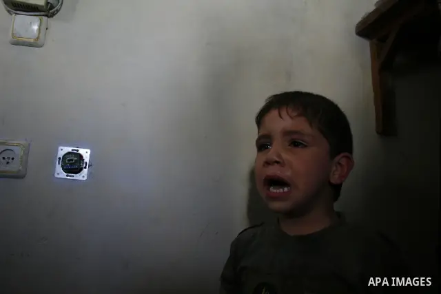 Palestinian relatives of Hamas militant Ahmed Suleiman, mourn during his funeral in Rafah town in the southern Gaza Strip. Suleiman was one of four Hamas fighters who detonated two booby-trapped vehicles disguised as Isr...