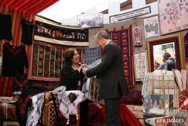 Former British Prime Minister and Middle East peace envoy Tony Blair visits an exhibition, at the Convention Palace, during the Palestine Investment Conference in Al-Khader village near the West Bank city of Bethlehem. B...