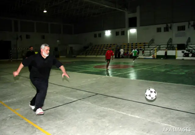 Palestinian Prime Minister Ismail Haniyeh plays football at a stadium shortly before the start of the truce with Israel.