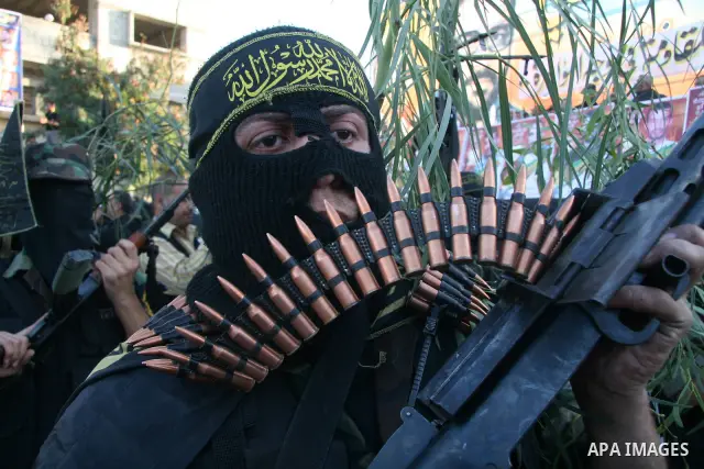 Masked Palestinian militants from Islamic Jihad take part in a training exercise as they demonstrate their skills for journalists on the outskirts of Gaza City. Tension surged in and around Gaza today as the Islamist rul...