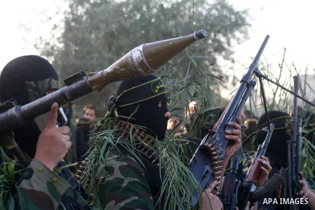 Masked Palestinian militants from Islamic Jihad take part in a training exercise as they demonstrate their skills for journalists on the outskirts of Gaza City. Tension surged in and around Gaza today as the Islamist rul...