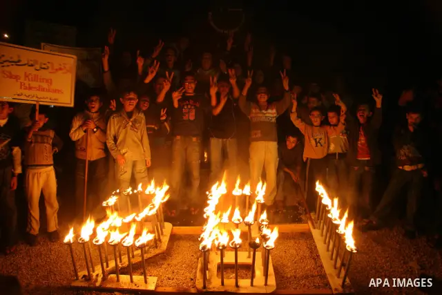 Palestinian children lights the Memorial of the number of the victims of Israeli blockade at Gaza strip(261) in Gaza city.