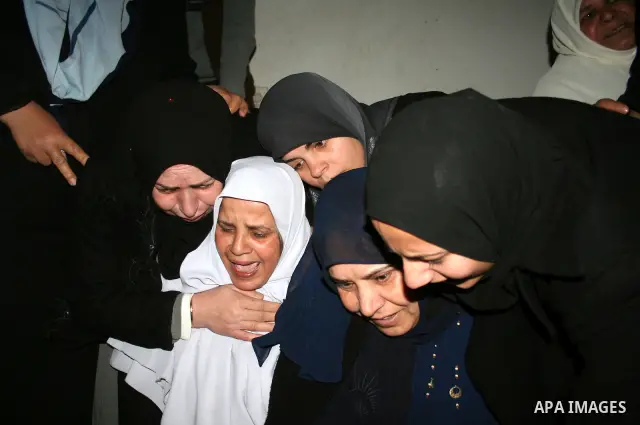 Palestinian relatives of Rami Kraym, a militant of the Military Wing of the Popular Front for Liberation Palestine "Abu Ali Mustafa Brigades" , mourn during his funeral in Gaza City. Kraym was killed during a fire exchan...