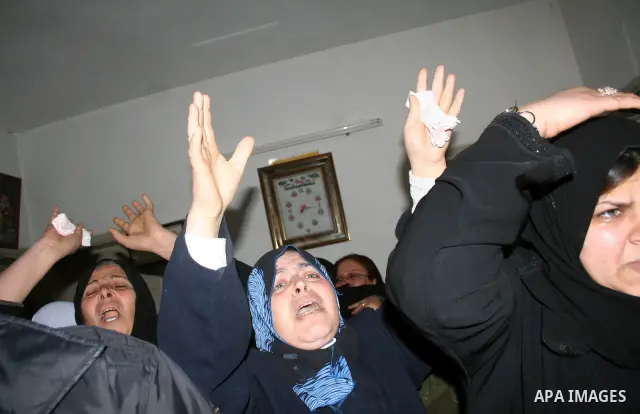 Palestinian relatives of Rami Kraym, a militant of the Military Wing of the Popular Front for Liberation Palestine "Abu Ali Mustafa Brigades" , mourn during his funeral in Gaza City. Kraym was killed during a fire exchan...