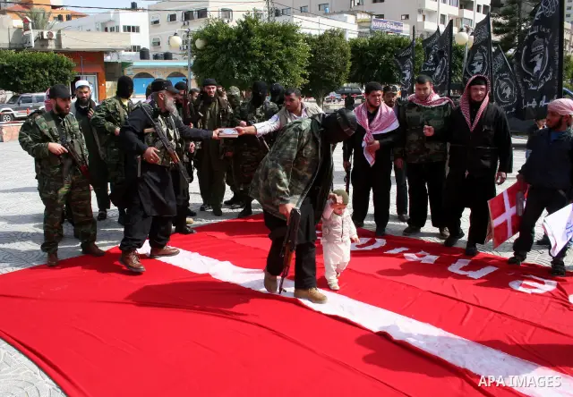Palestinians take part in a rally in Gaza. The rally, organised by popular resistant committees, was a protest against a cartoon of Prophet Mohammad that was republished by Danish newspapers on February 13. The reprinted...