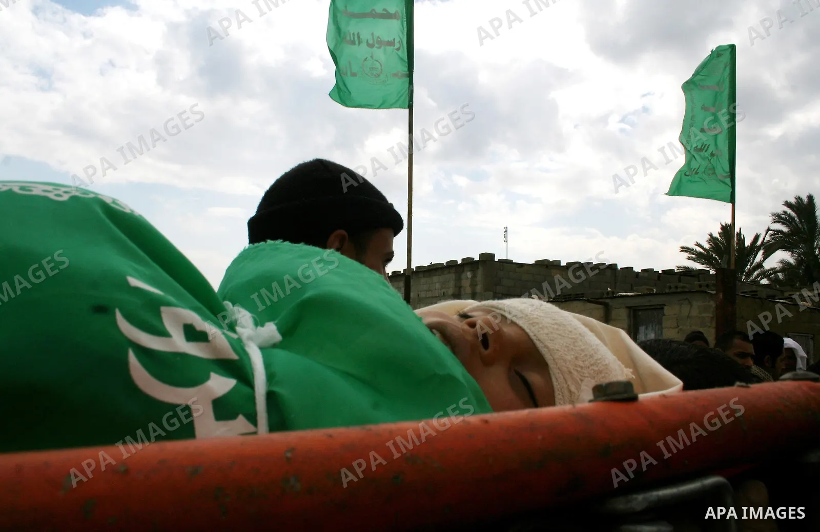 People carry the body of 10-year-old Tamir Abu Shair, who was killed by Israeli soldiers on Tuesday, during his funeral in Deer El-Balah city, central Gaza Strip. Israeli soldiers shot and killed a 10-year-old boy and a...