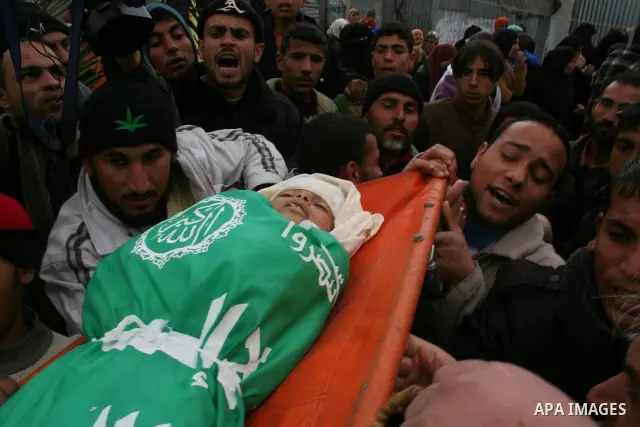 People carry the body of 10-year-old Tamir Abu Shair, who was killed by Israeli soldiers on Tuesday, during his funeral in Deer El-Balah city, central Gaza Strip. Israeli soldiers shot and killed a 10-year-old boy and a...