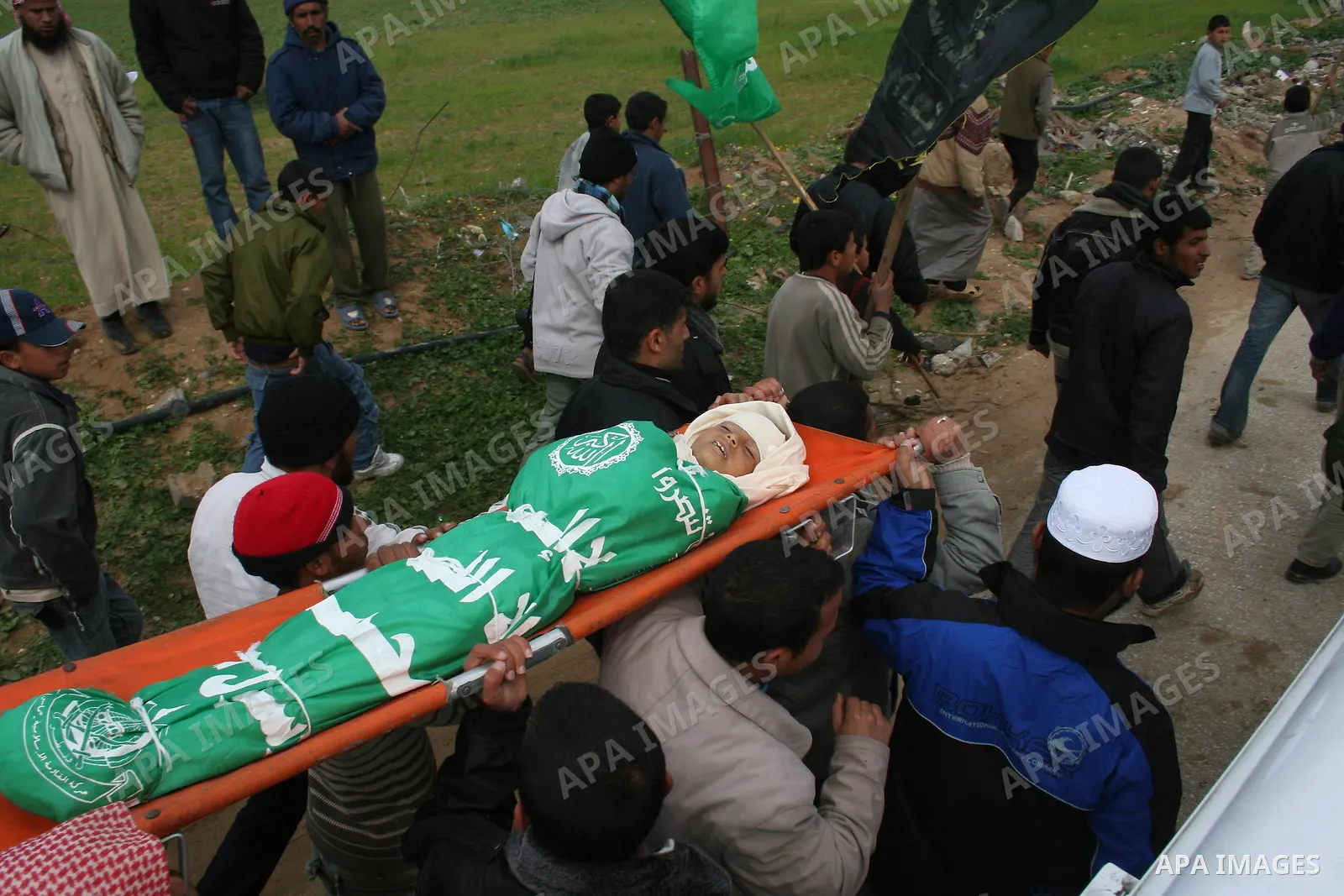 People carry the body of 10-year-old Tamir Abu Shair, who was killed by Israeli soldiers on Tuesday, during his funeral in Deer El-Balah city, central Gaza Strip. Israeli soldiers shot and killed a 10-year-old boy and a...