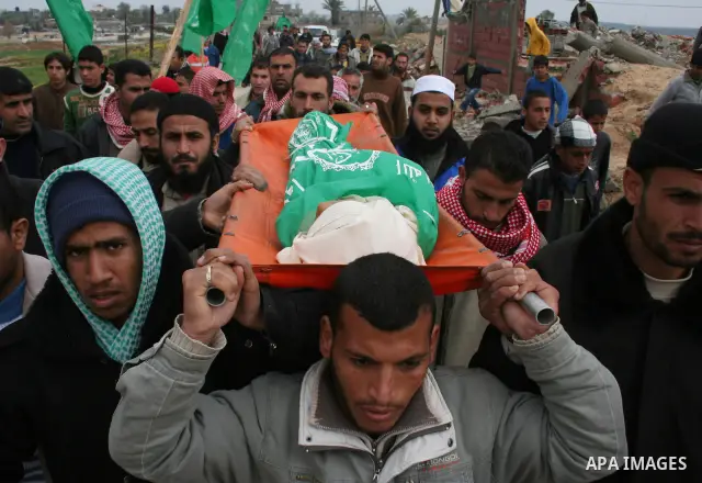 People carry the body of 10-year-old Tamir Abu Shair, who was killed by Israeli soldiers on Tuesday, during his funeral in Deer El-Balah city, central Gaza Strip. Israeli soldiers shot and killed a 10-year-old boy and a...