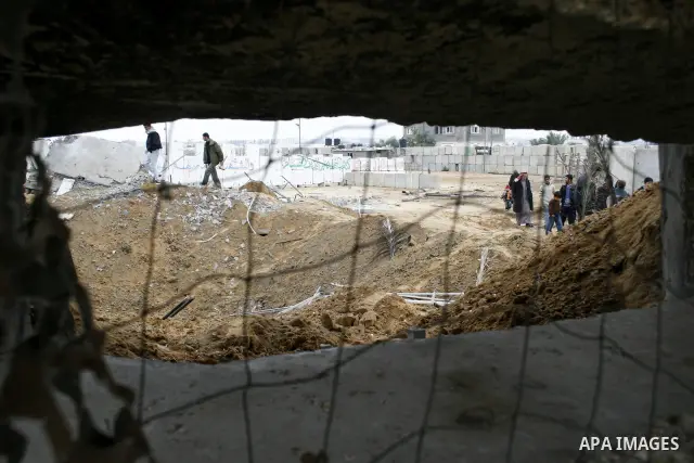Palestinian children play at Hamas training camp after it was destroyed by Israeli air strike in Rafah, southern Gaza Strip. two Israeli brothers, ages 8 and 19, were seriously wounded when a rocket from Gaza slammed int...