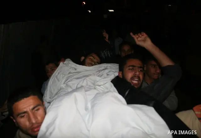 Palestinians carry the body of one of three Islamic Jihad militants killed in Israeli airstrikes to the morgue of al-Shifa hospital in Gaza City. Israeli aircraft killed three members of Islamic Jihad who were preparing...
