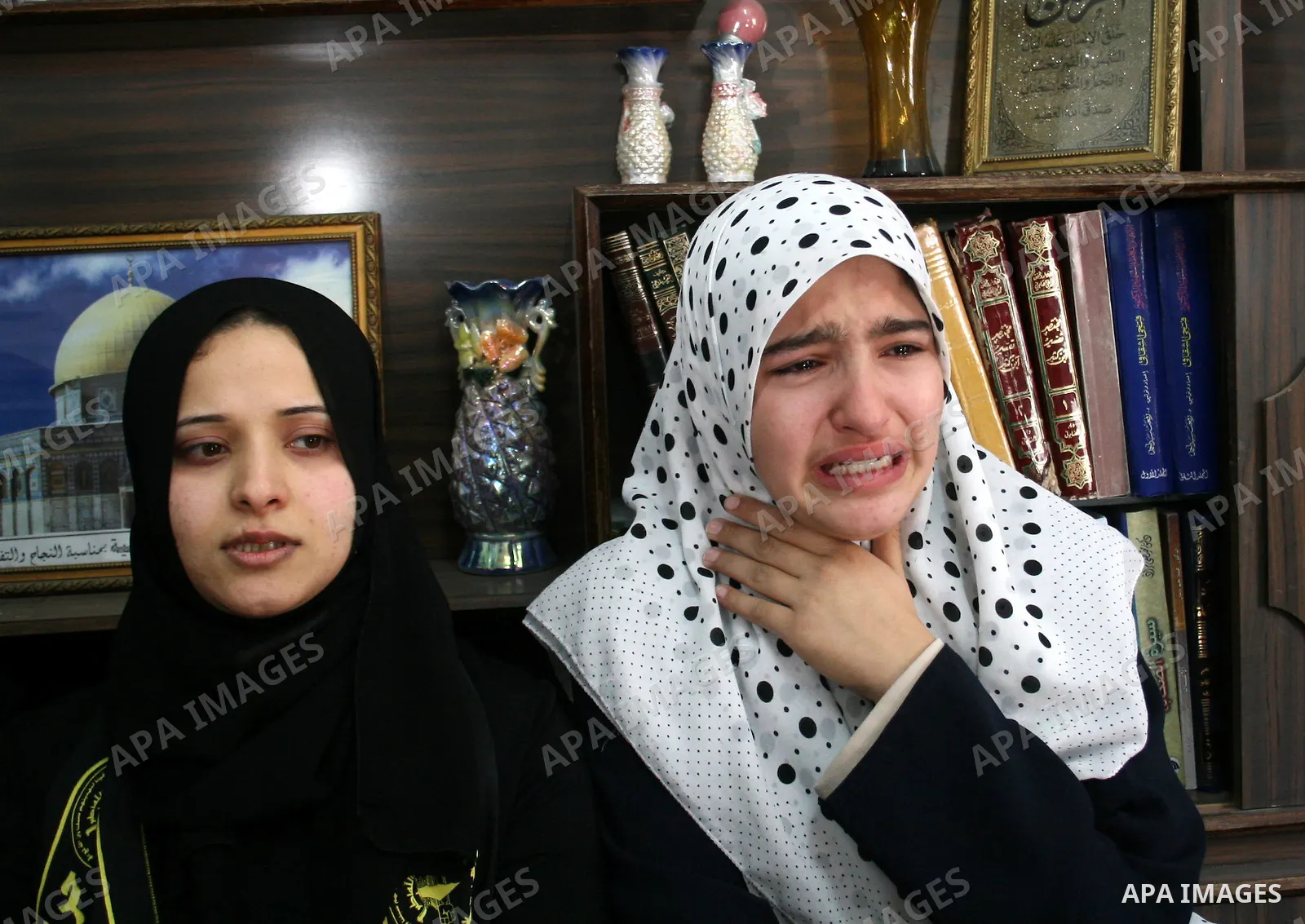 Palestinian relatives mourn during the funeral of Hassan Shaqora, one of the three Islamic Jihad militants killed in Israeli airstrikes, in Beit Lahia, northern Gaza Strip. An Israeli air strike today killed three Islami...