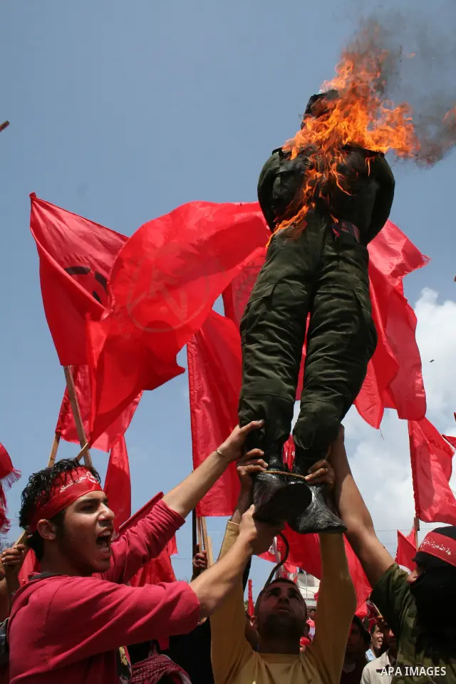Palestinians burn an effigy of Israel's Defence Minister Ehud Barak during a protest against the lack of employment opportunities in Gaza City April 30, 2009, a day before World Labour Day APAIMAGES PHOTO / Ashraf Amra