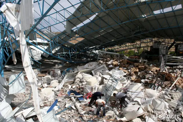 A Palestinian man walks on the rubble of his factory which was destroyed during the Gaza war in Jabalia in the northern Gaza Strip on April 30, 2009, a day before World Labour Day (May Day) APAIMAGES PHOTO / Ashraf Amra