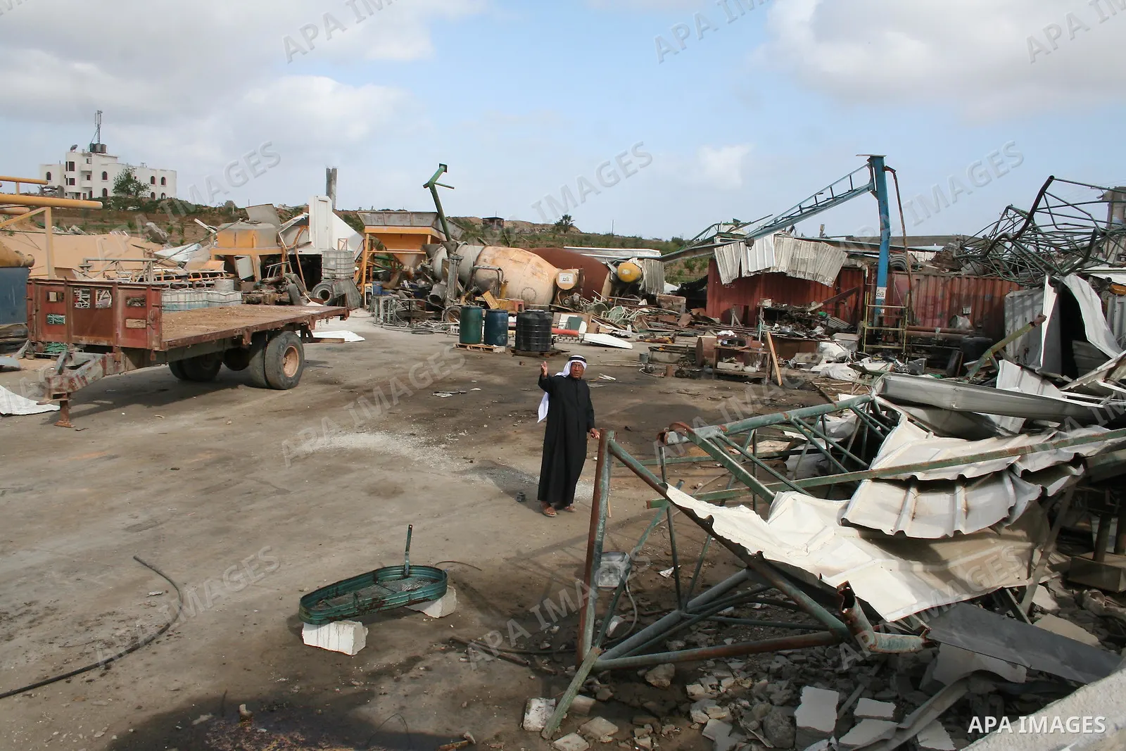A Palestinian man walks on the rubble of his factory which was destroyed during the Gaza war in Jabalia in the northern Gaza Strip on April 30, 2009, a day before World Labour Day (May Day) APAIMAGES PHOTO / Ashraf Amra