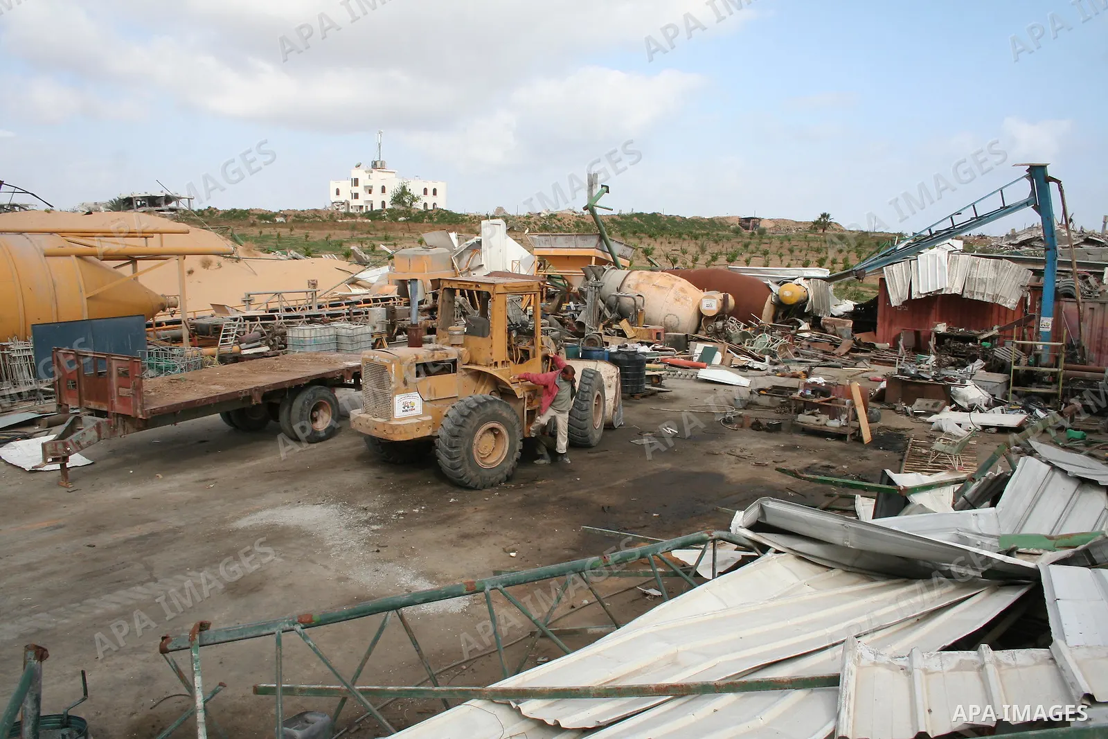 A Palestinian man walks on the rubble of his factory which was destroyed during the Gaza war in Jabalia in the northern Gaza Strip on April 30, 2009, a day before World Labour Day (May Day) APAIMAGES PHOTO / Ashraf Amra