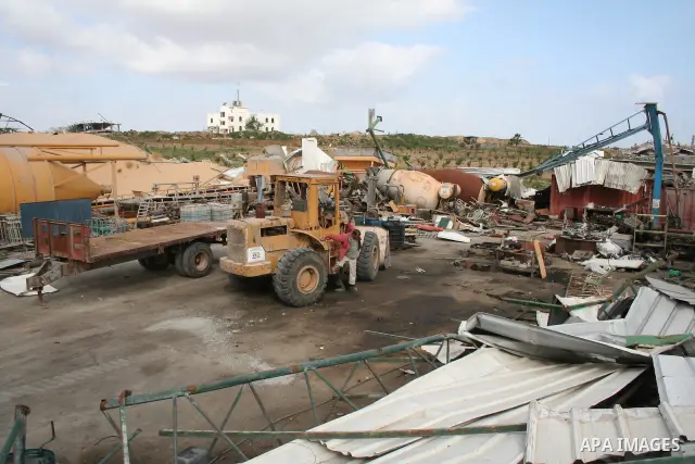 A Palestinian man walks on the rubble of his factory which was destroyed during the Gaza war in Jabalia in the northern Gaza Strip on April 30, 2009, a day before World Labour Day (May Day) APAIMAGES PHOTO / Ashraf Amra