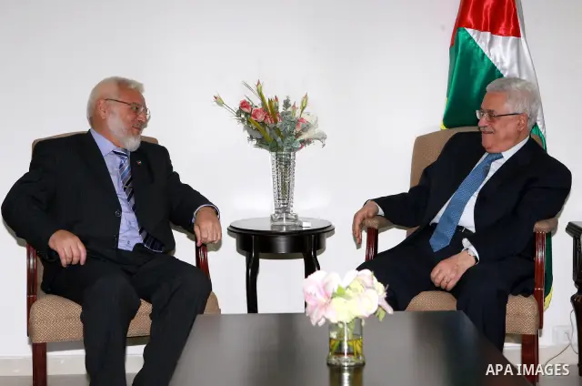 Palestinian President Mahmoud Abbas meets with the freed parliament deputy Abdul Aziz Dweik in the West Bank City of Ramallah on June 30, 2009. photo by Thaer Ganaim