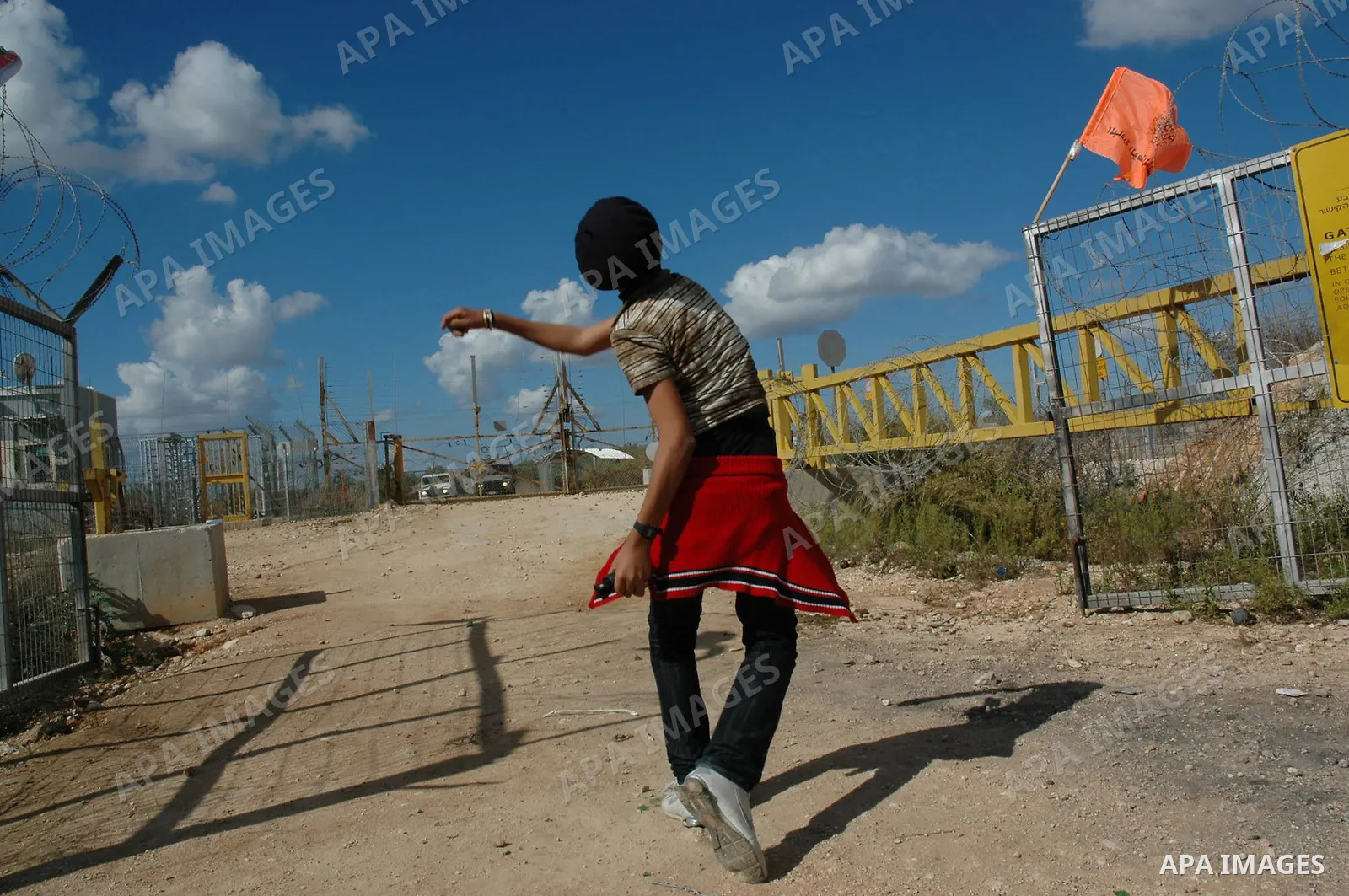 Palestinian demonstrators clash with the Israeli army during a demonstration against the separation wall in the village of Deir Gson in the West Bank city of Tulkarem on Nov 14, 2009. Photo by Nedal Shtieh