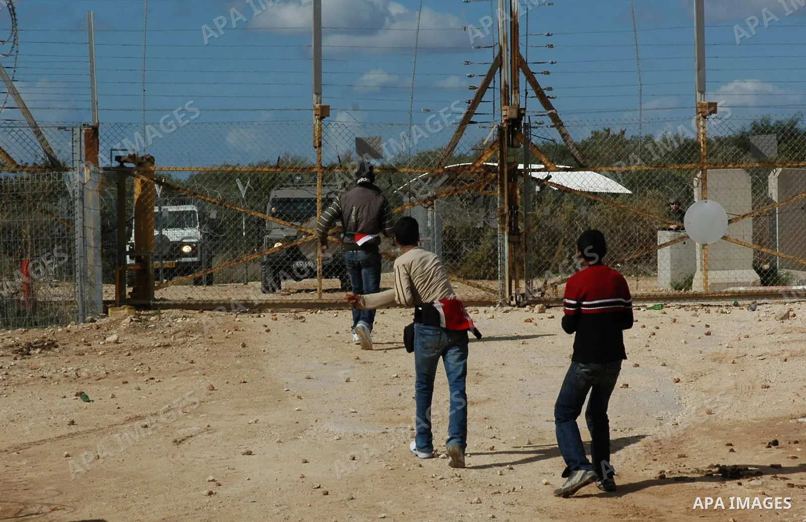 Palestinian demonstrators clash with the Israeli army during a demonstration against the separation wall in the village of Deir Gson in the West Bank city of Tulkarem on Nov 14, 2009. Photo by Nedal Shtieh