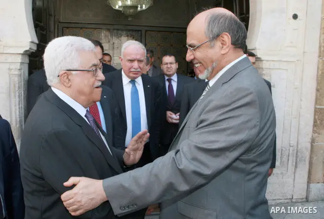 Palestinian president Mahmoud Abbas shakes hands with Tunisia's Prime Minister, Hamadi Jebali (R), in Tunisia, on April 30, 2012. Palestinian President Mahmud Abbas arrived in Tunisia on April 28 for a three-day official...