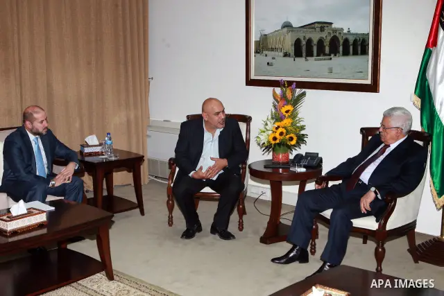 Palestinian President, Mahmoud Abbas (Abu Mazen) meets with the director and film producer Rashid Mashharawi, in the West Bank city of Ramallah, on May 28, 2012. Photo by Thaer Ganaim