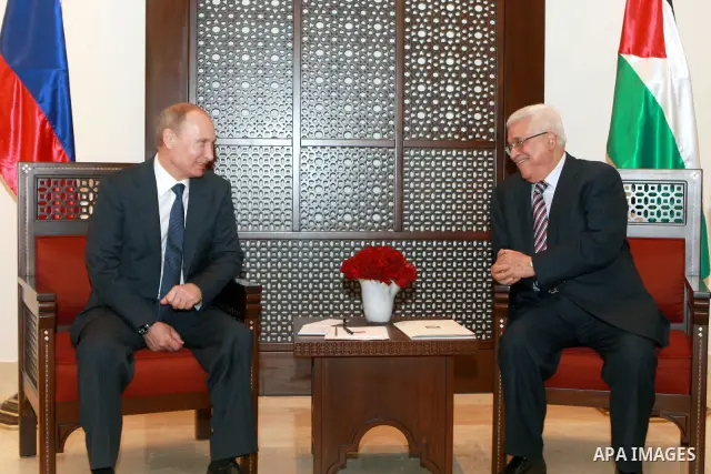 Palestinian President Mahmoud Abbas meets with his Russian counterpart Vladimir Putin at his office in the West Bank city of Bethlehem on June 26, 2012. Photo by Thaer Ganaim
