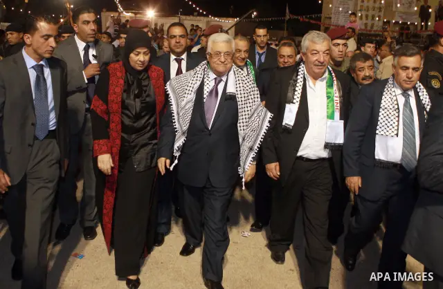 Palestinian President Mahmoud Abbas attends a mass wedding for 19 Groom in the village of Silwad in the West Bank city of Ramallah, June 28, 2012. Photo by Thaer Ganaim