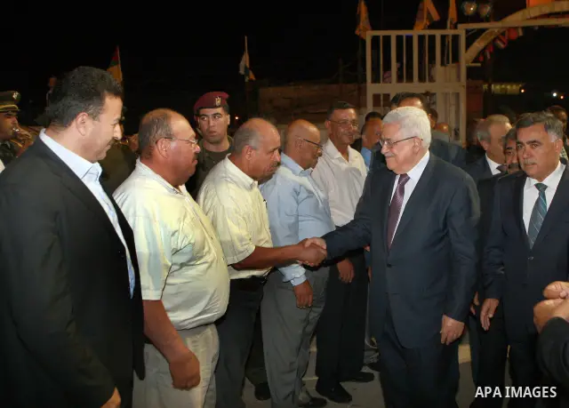 Palestinian President Mahmoud Abbas attends a mass wedding for 19 Groom in the village of Silwad in the West Bank city of Ramallah, June 28, 2012. Photo by Thaer Ganaim
