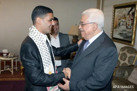 Palestinian President, Mahmoud Abbas (Abu Mazen), meets with Palestinian prisoner Mahmoud Sersak, in Doha on July. 22, 2012. Photo by Thaer Ganaim