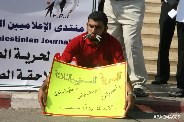 Palestinian journalists attend a protest calling for stop the violence against the journalists in front of the legislative council in Gaza City.