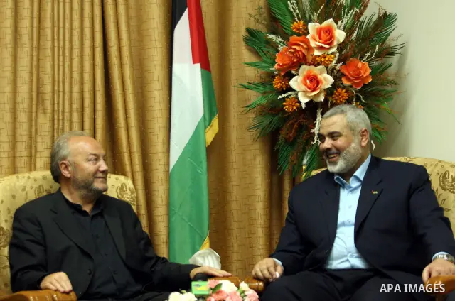 Senior Hamas leader Ismail Haniyeh hugs British politician George Galloway during their meeting in Gaza, in this picture released by Haniyeh's office March 11, 2009. About 50 British volunteers and 100 vehicles carrying...