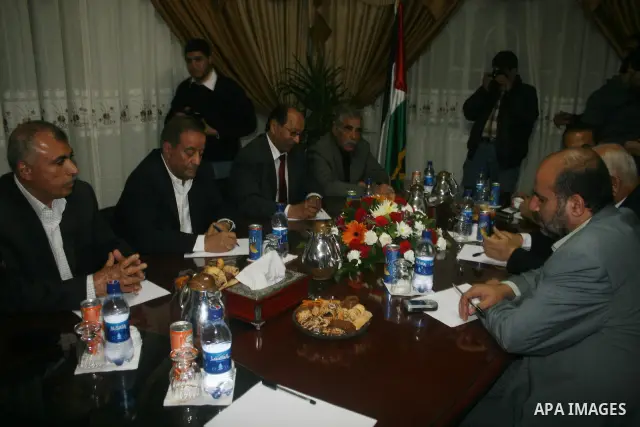 Palestinian Fatah officials (fron front-L) Hisham Abdul Raziq, Marwan Abdul Hamid, Abdullah al-Ifranji, and Ibrahim Abu al-Naja meet with Hamas officials (from front-R) Ismail al-Ashqar, Jamal Abu Hashem and Ayman Taha i...