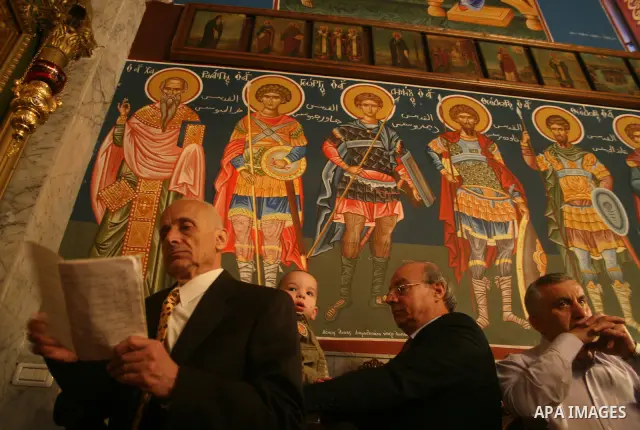 Palestinian Christian Orthodox worshippers celebrate a Palm Sunday mass in Gaza City on April 12, 2009. As Western Christians mark marked Easter Sunday, Orthodox churches were celebrating Palm Sunday, a week ahead of the...